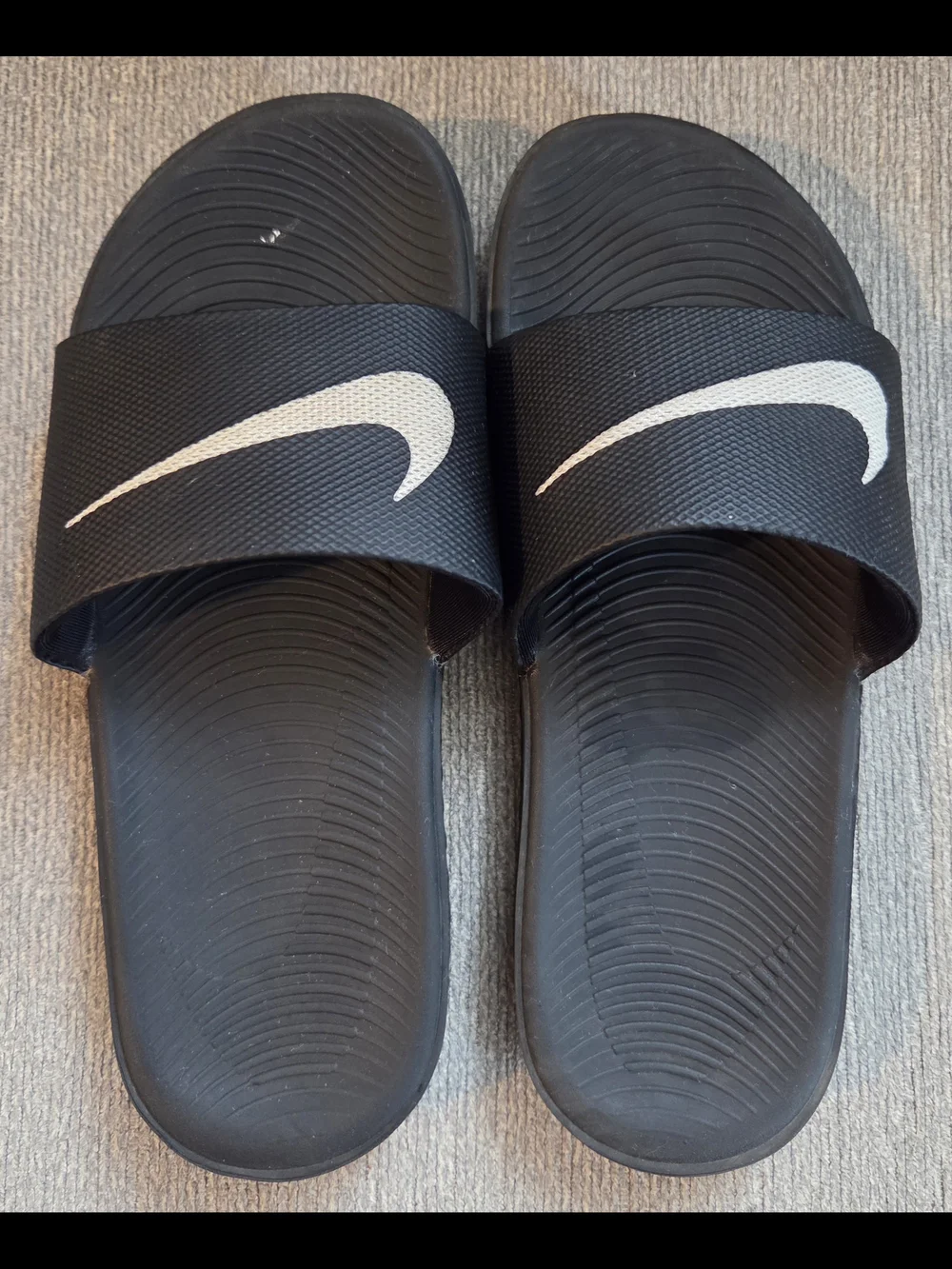 Nike Black Slide Sandals with White Swoosh Logo